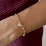 Pulseira bolinhas com pingente coração microcravejado em prata 925 e banho de ouro 18k
