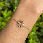 Pulseira flor com zircônias coloridas em banho de ouro 18k